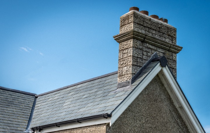 Scottish stone cottage with chimney and slate roof